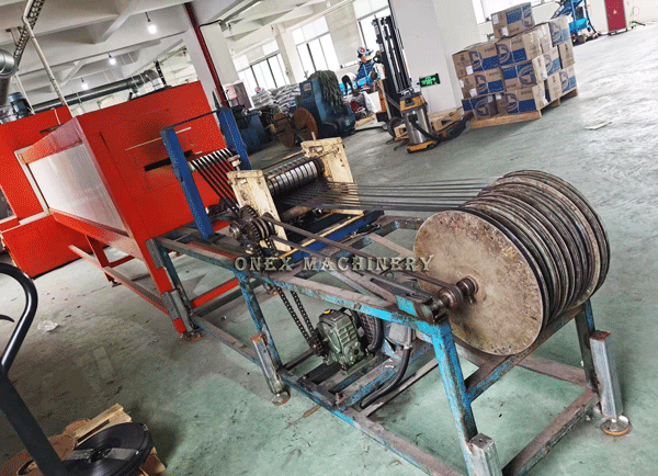Coating machine for metal cable ties